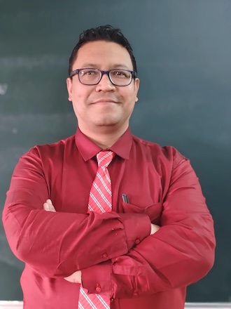 Primary school teacher looking into the camera
