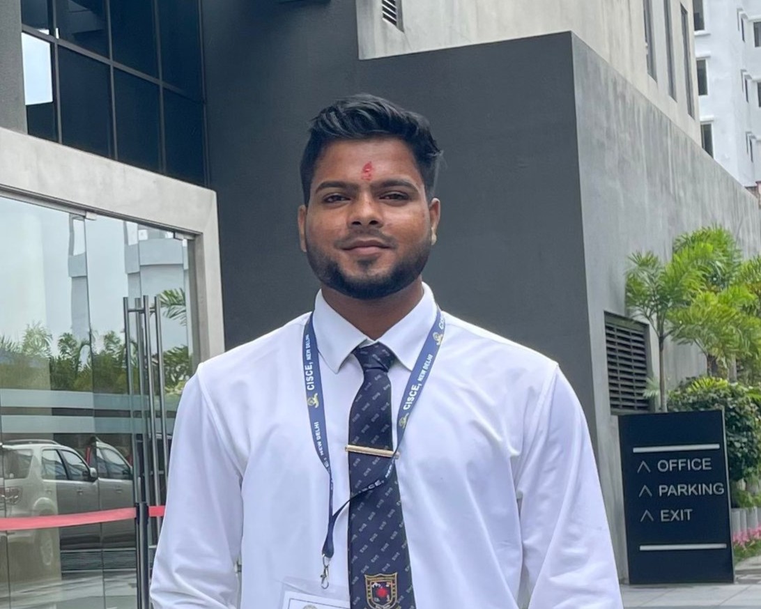 Primary school teacher looking into the camera