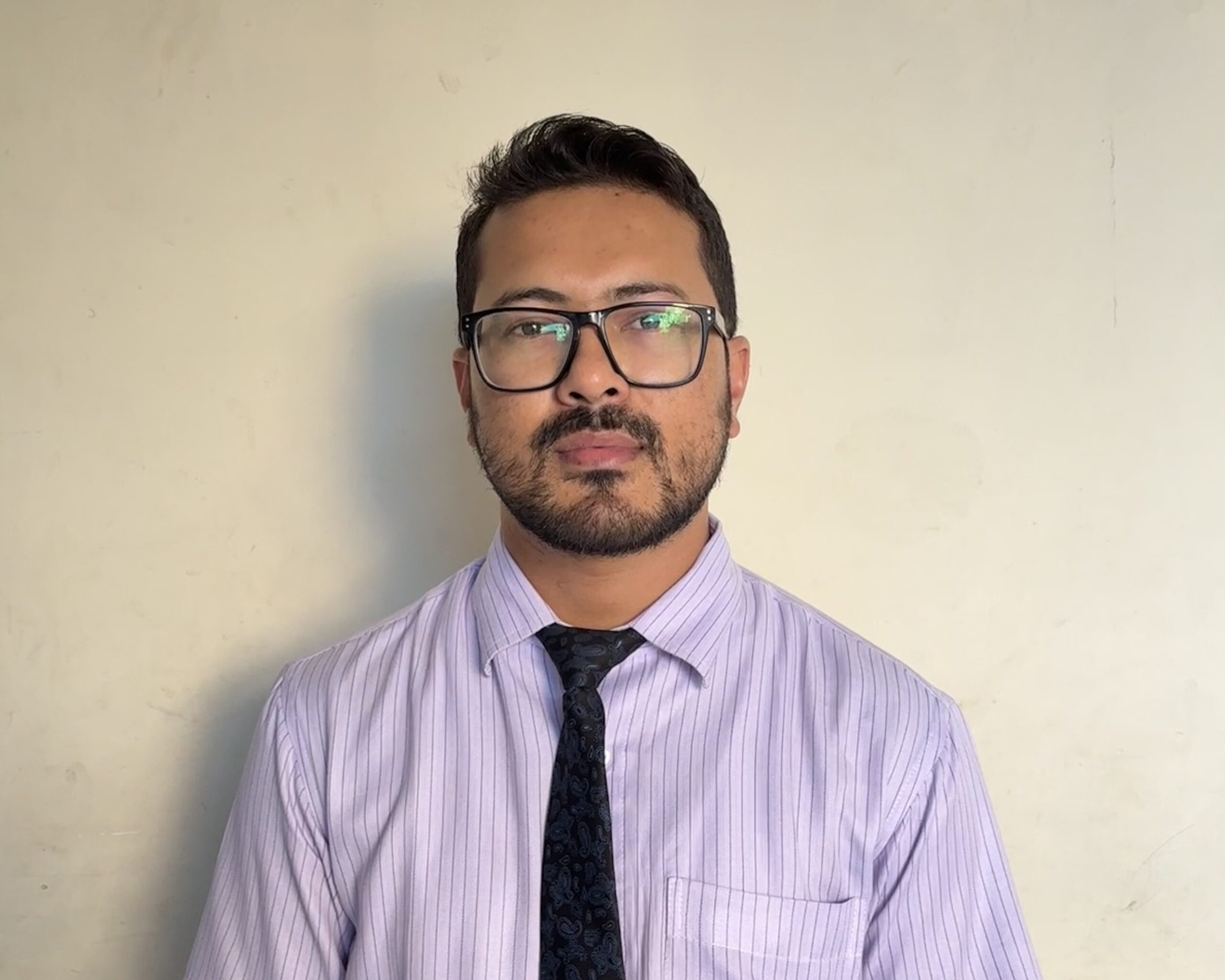 Middle School teacher looking into the camera