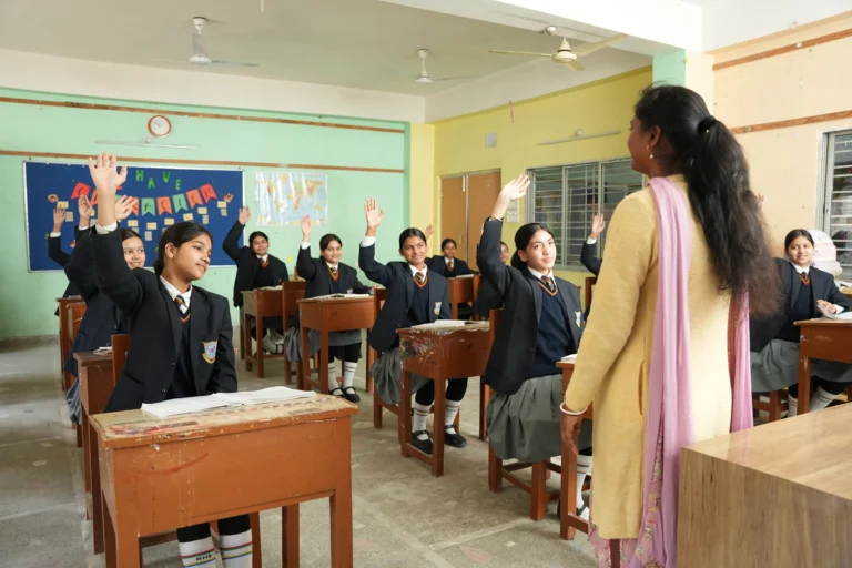 students raising their hands